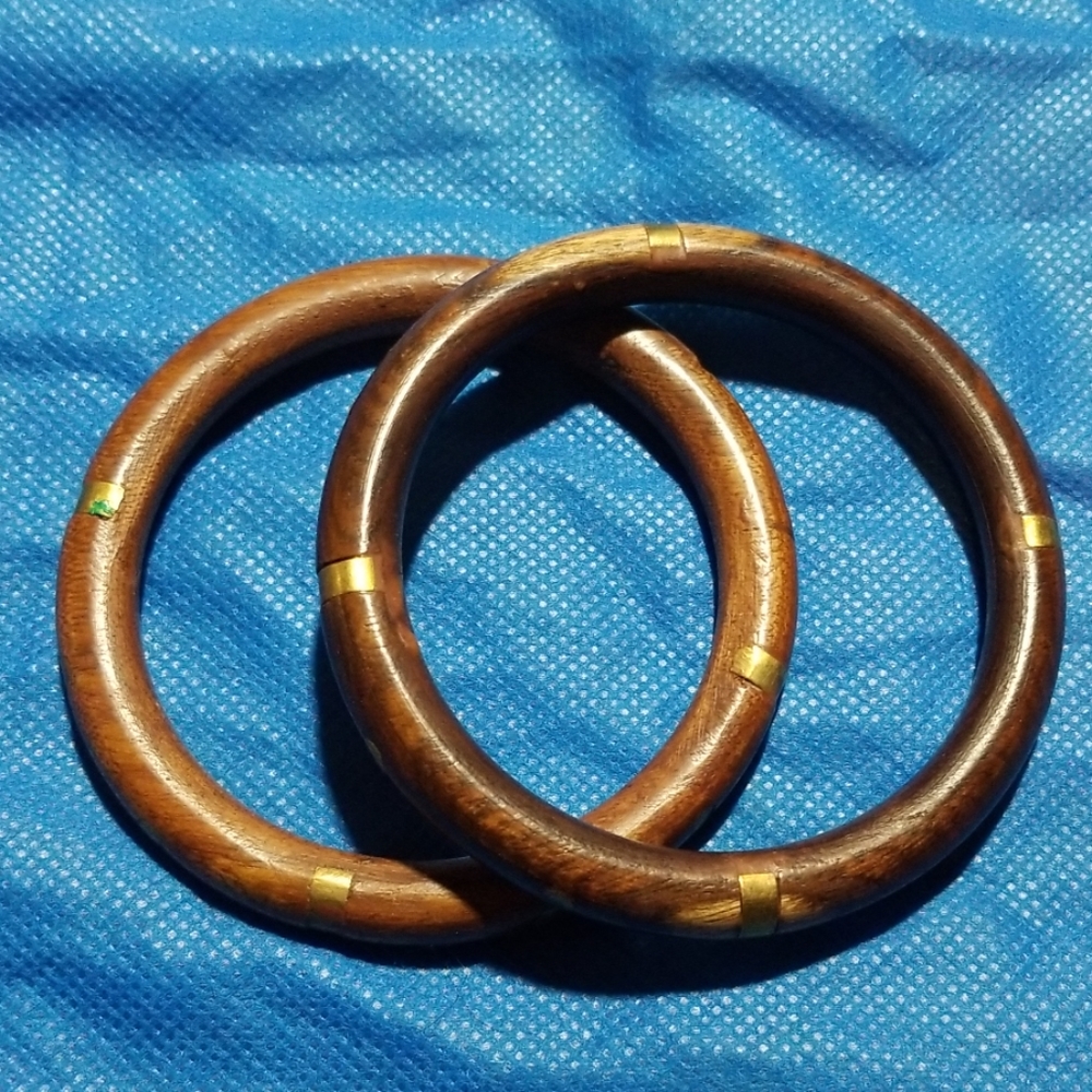 Pair of wooden bangles with gold accents
